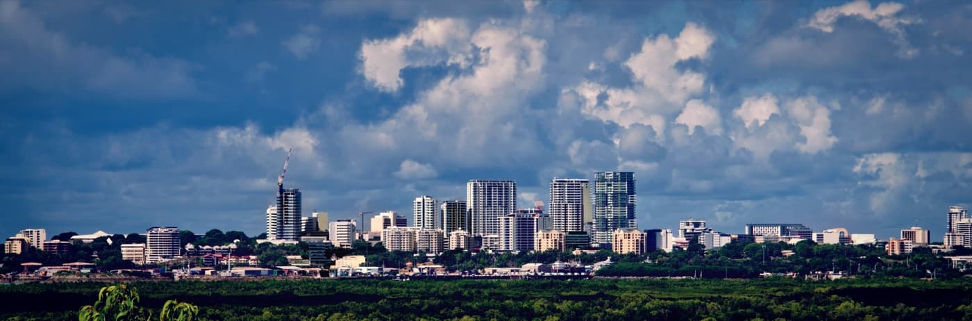 Darwin city skyline across tropical harbour water